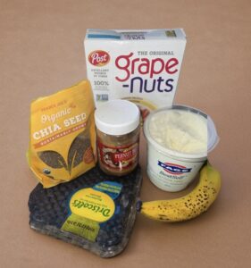 Healthy ingredients for lactose-free Greek yogurt parfait including fruits and Grape-Nuts